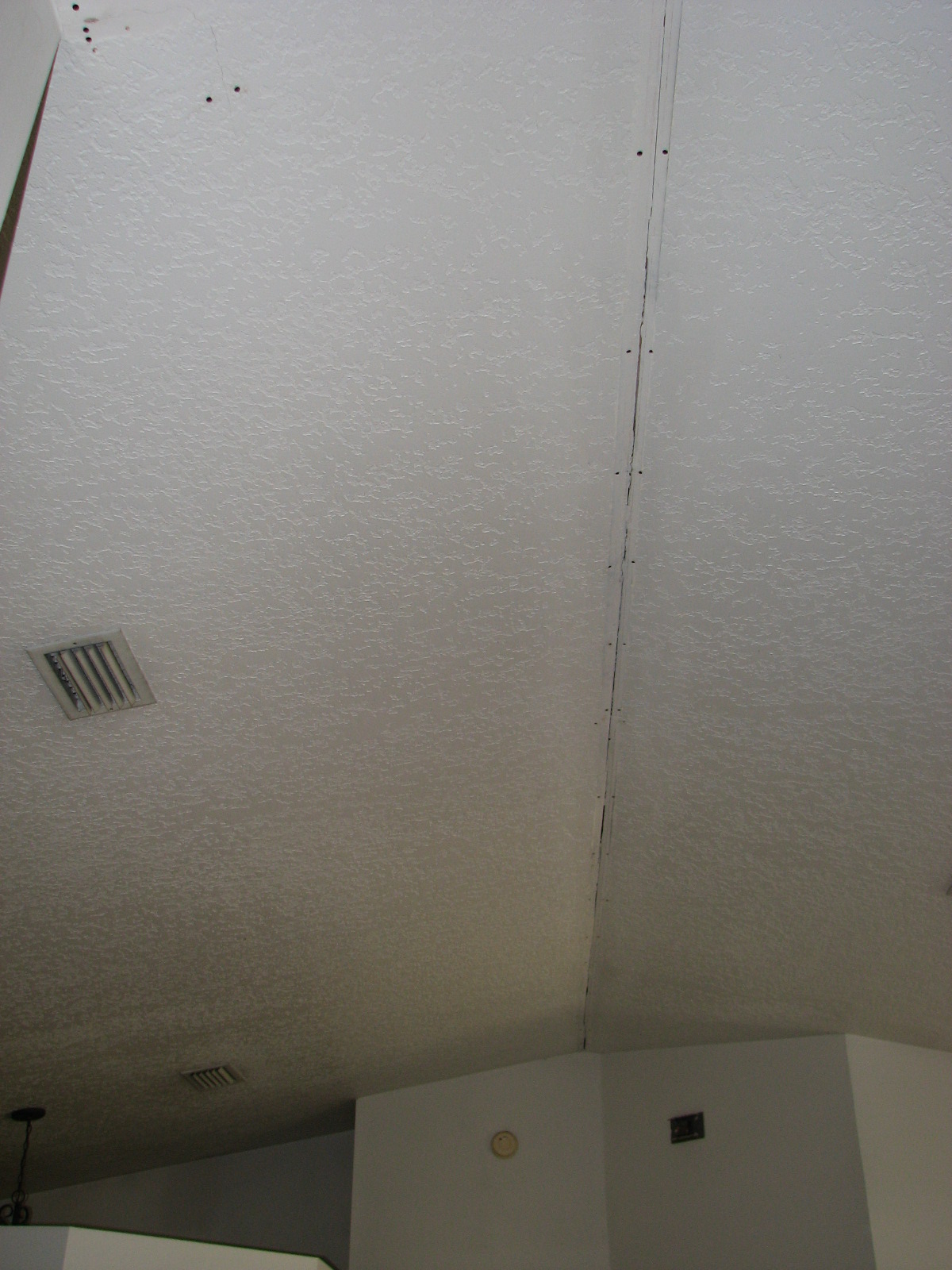 Vaulted Ceiling Tape Joint Repair by Peck Drywall and Painting Interior painting and repairs.