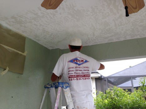 Applying skip trowel texture to the ceiling