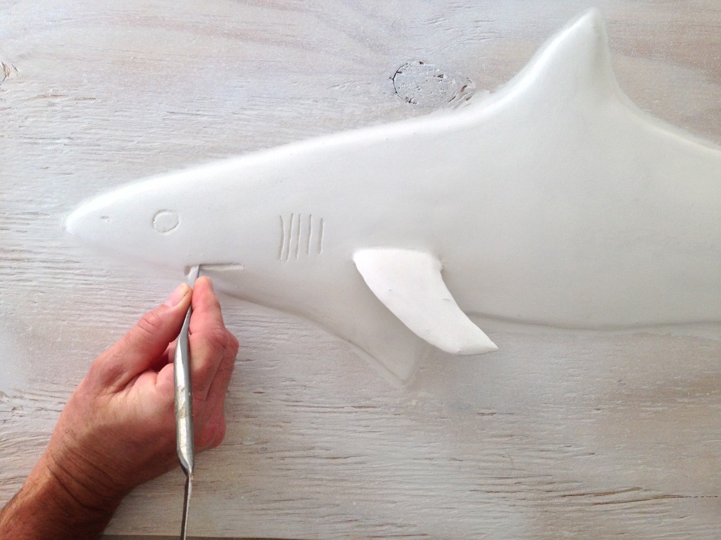 Sculpting my shark  drywall art sculpture